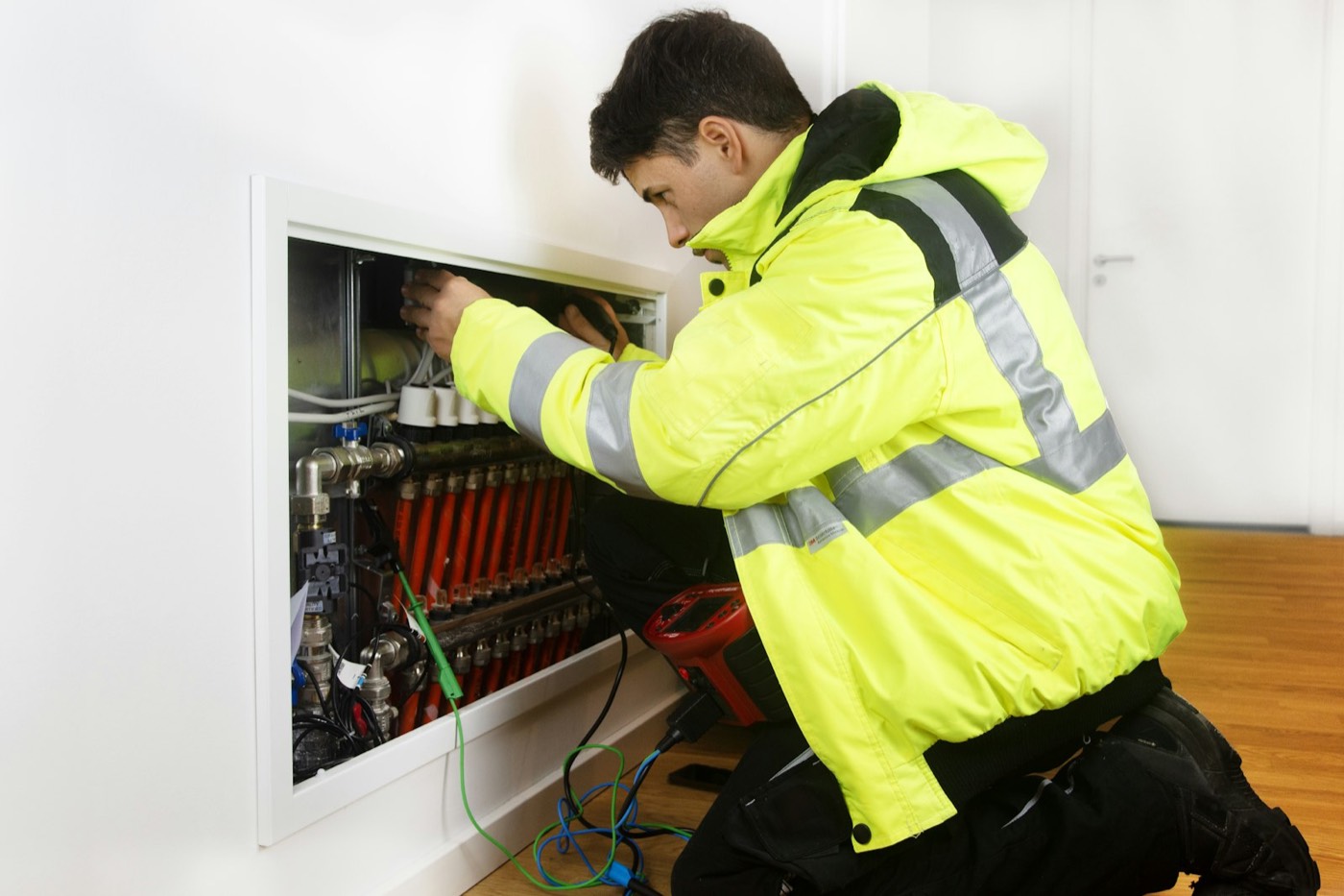 HVAC technician servicing a residential heating system